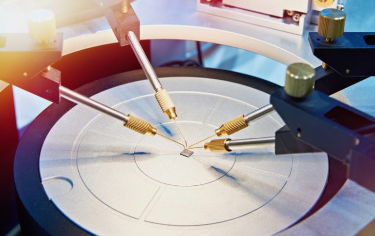 A coaxial probe connects RF/microwave test equipment